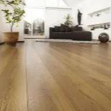 Brown wooden floor with flower petals