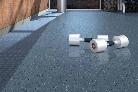 Gym rubber flooring with dumbbells